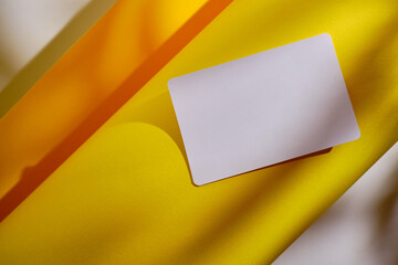 Blank business card, postcard on a colored background. Place for text and information. Mockup