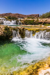 Fototapeta premium Wadi Darbat (The Darbat Valley) is the most beautiful and scenic spot with waterfalls in Dhofar Region in Sultanate of Oman