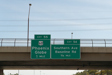 Signs on AZ 101 Loop for Exit 55 US 60 toward Phoenix and Globe, and Exit 54 for Southern Ave and Baseline Rd