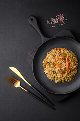 Delicious Uzbek pilaf with chicken, carrots, barberry, spices and herbs