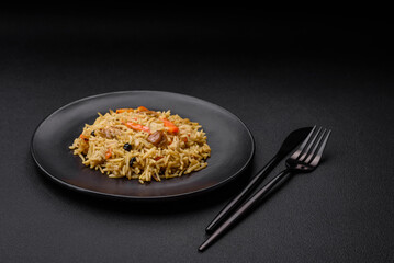 Delicious Uzbek pilaf with chicken, carrots, barberry, spices and herbs