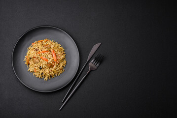 Delicious Uzbek pilaf with chicken, carrots, barberry, spices and herbs