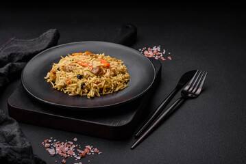 Delicious Uzbek pilaf with chicken, carrots, barberry, spices and herbs