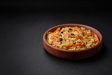 Delicious Uzbek pilaf with chicken, carrots, barberry, spices and herbs