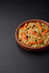 Delicious Uzbek pilaf with chicken, carrots, barberry, spices and herbs