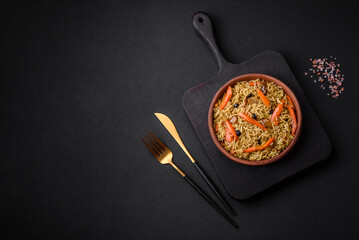 Delicious Uzbek pilaf with chicken, carrots, barberry, spices and herbs