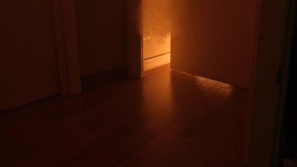 Fire in the apartment with smoke in the room. Smoke in the apartment from behind the door.