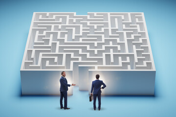 Businessman trying to find a way out of maze