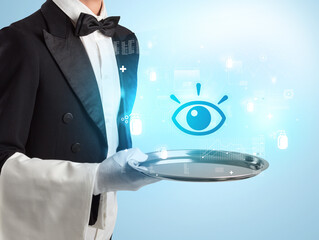 Handsome young waiter in tuxedo holding healthcare icons on tray