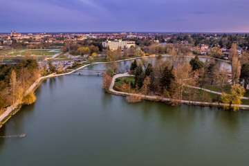 Birds eye shot of the Boating Lake of Szombathely, Hungary with the city's view in the background 