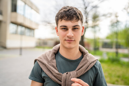 portrait of young Caucasian man teenager 18 or 19 years old outdoor