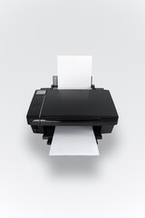 Close-up of black printer and white paper