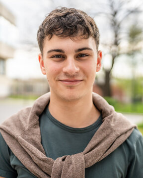 portrait of young Caucasian man teenager 18 or 19 years old outdoor