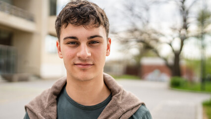 portrait of young Caucasian man teenager 18 or 19 years old outdoor