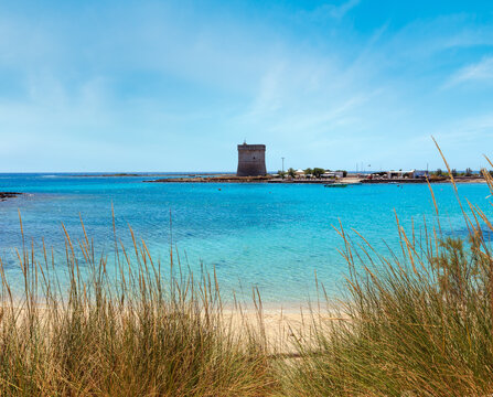 Picturesque Torre Chianca beach and historical fortification tower Torre Chianca (Torre Santo Stefano) on Salento Ionian sea coast, Porto Cesareo, Puglia, Italy