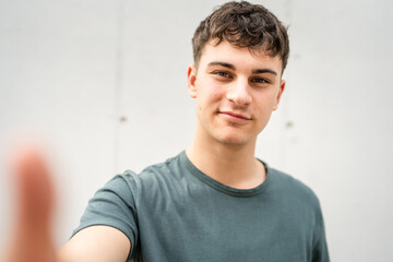 portrait of young Caucasian man teenager 18 or 19 years old outdoor