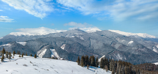 Picturesque snowy winter Skupova mountain slope and lone farmhouse on plateau farmstead,...