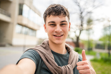 portrait of young Caucasian man teenager 18 or 19 years old outdoor
