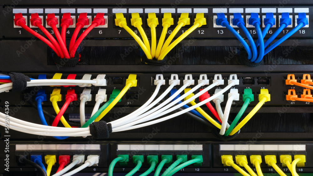 Poster multi colored network cables connected to switch, network technology concept