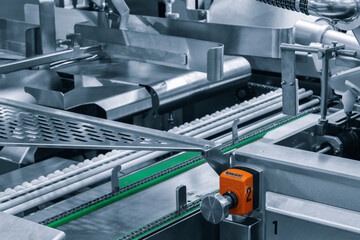 Conveyor Belt Food.Factory for the production of food. Production line with packaging. Food products  in plastic packaging on the conveyor. food production concept