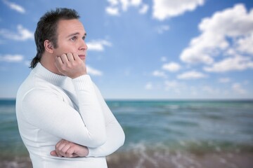 Relaxed young man breathing air on sea beach