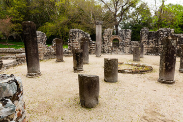 Fototapeta premium Ruins of Butrint Baptistery in Albania. View of stone columns and walls.