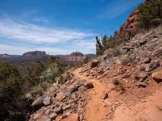 Obraz premium Rocky Desert Mountain Hiking Path on a Slope on a Partly Cloudy Day