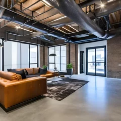 Foto op Canvas 16 An urban loft-style living room with exposed ductwork, concrete floors, and industrial accents4, Generative AI © Ai.Art.Creations