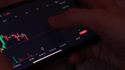 Investment stockbroker analysis data graph with price rates. Crypto trader investor broker holding using smartphone app analyzing financial data stock market on cell phone, checking online trading - Powered by Adobe