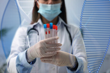 Genetic testing. Laboratory worker with test tubes and illustration of DNA structure, double...