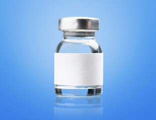 COVID-19 VACCINE ampoule bottle on the desk