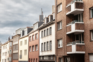 Typical residetial street with multistorey residential buildings in a suburban street of Aachen, germany, in a Western European background.