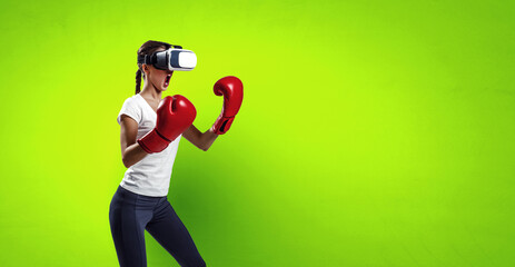 Young woman boxing in VR glasses