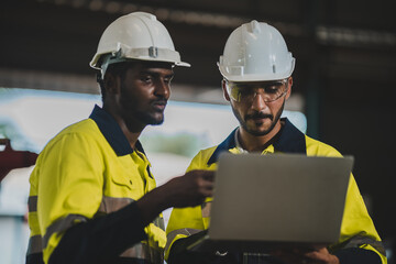 professional technician engineer with safety helmet hard hat working in industrial manufacturing factory, men at work to checking equipment of machinery production technology or construction operating