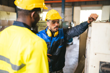 Technical engineer workers working in control room plant at industry factory to service maintenance on engineering machine, production technician occupation in global industrial business concept