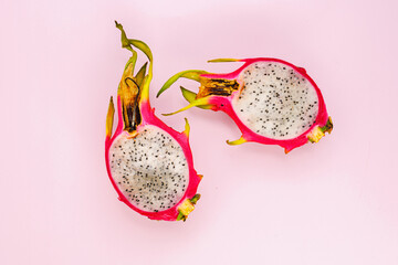 Tropical exotic fruits. Pitahaya on a pink background. Close-up. Place for text. Dragon fruit.