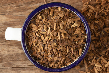 Brazilian mate tea in a cup. Selective focus.