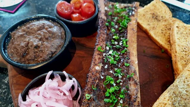 beef bone marrow grill backed western cuisine serve with liver paste and pickle
