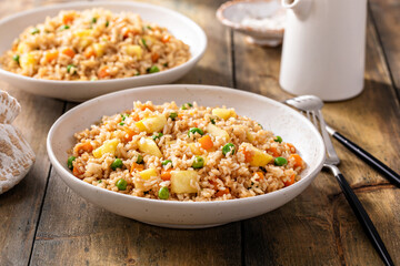 Pineapple fried rice with peas and carrots