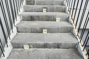 Gray cement steps in the city Closeup concrete staircase with railing, old staircase detail, abstract stone staircase background.