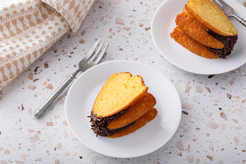 Orange pound cake with dark chocolate ganache and sprinkles