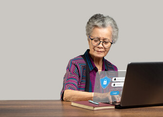 Senior woman login by username and password on the virtual screen from a laptop