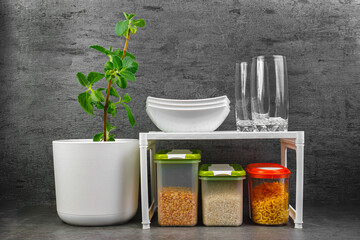 Kitchen shelf with bulk products. Containers for storing rice, cereals. organization of food storage in the kitchen, transparent reusable jars for cereals and pasta, zero waste pantry