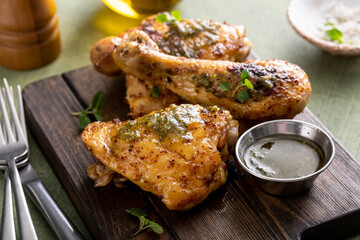 Roasted lemon and herb chicken drumsticks and thighs - obrazy, fototapety, plakaty