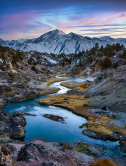 Mammoth Mountain at Sunset with Hot Creek in the Foreground.