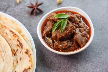 Spicy beef curry. Goan style beef vindaloo. Traditional Indian Lamb or beef curry . spicy Beef curry gravy popular in Kerala Sri Lankan Goa for Appam, Parotta porotta in India.
