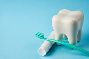 Fototapeta na wymiar Toothbrush with toothpaste and white tooth