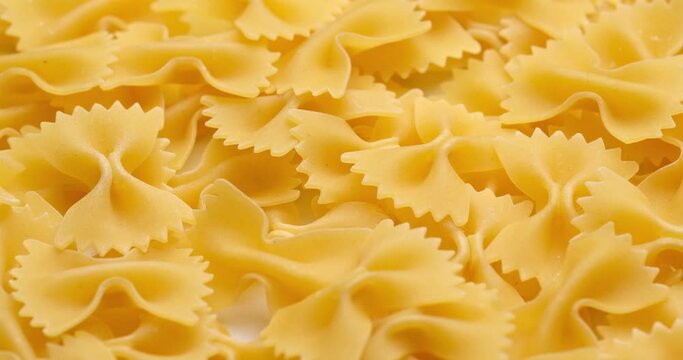 pasta backgroud - macro view of Dry Authentic Italian farfalle