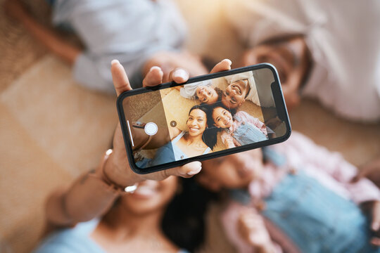 Happy, relax and selfie of family on floor of living room for social media, communication and internet from above. Website, funny and picture with parents and children at home for love and bonding