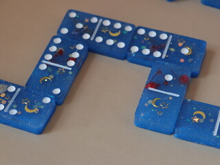 Handmade domino blue with gold on beige background